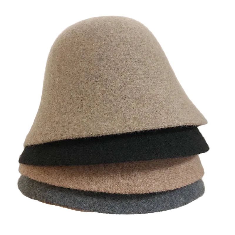 A women's hat made of wool felt, with a hemispherical crown, a cylindrical body, and a short brim. It was the signature women's hat of the 1920s.