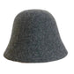 A women's hat made of wool felt, with a hemispherical crown, a cylindrical body, and a short brim. It was the signature women's hat of the 1920s.