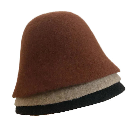 A women's hat made of wool felt, with a hemispherical crown, a cylindrical body, and a short brim. It was the signature women's hat of the 1920s.