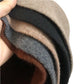 A women's hat made of wool felt, with a hemispherical crown, a cylindrical body, and a short brim. It was the signature women's hat of the 1920s.