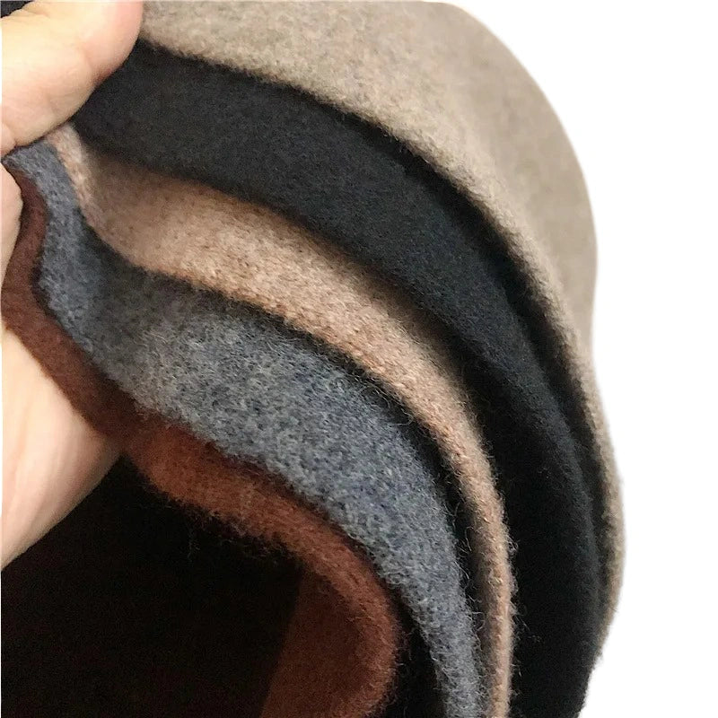 A women's hat made of wool felt, with a hemispherical crown, a cylindrical body, and a short brim. It was the signature women's hat of the 1920s.